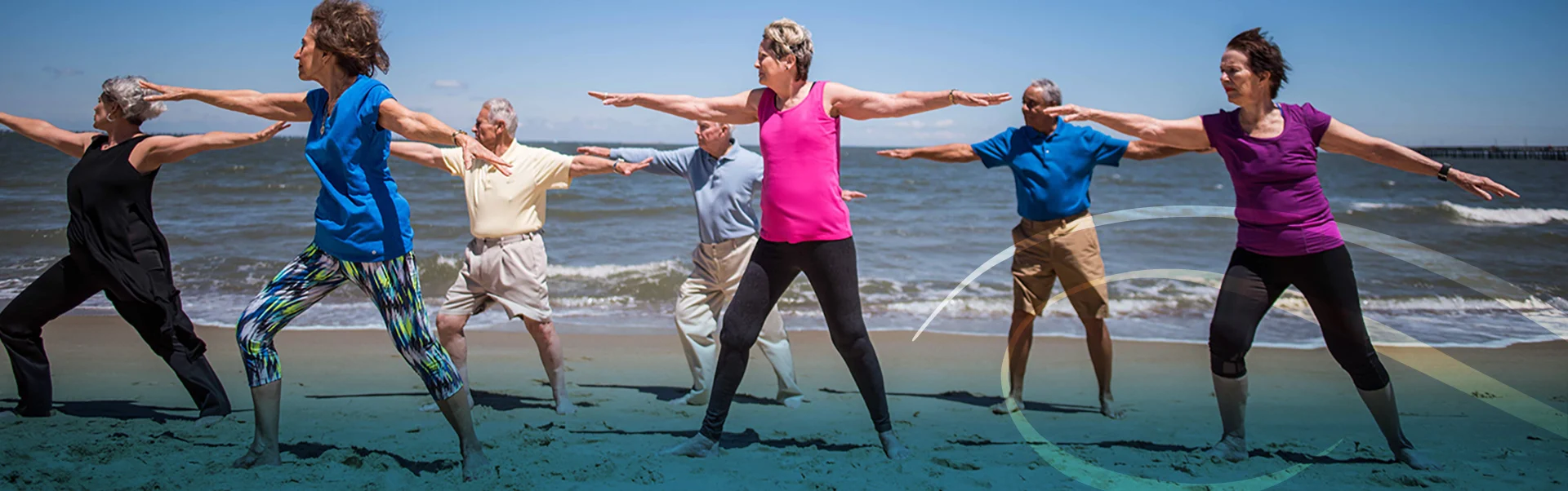 Group of People Performing Yoga Exercise at the Beach