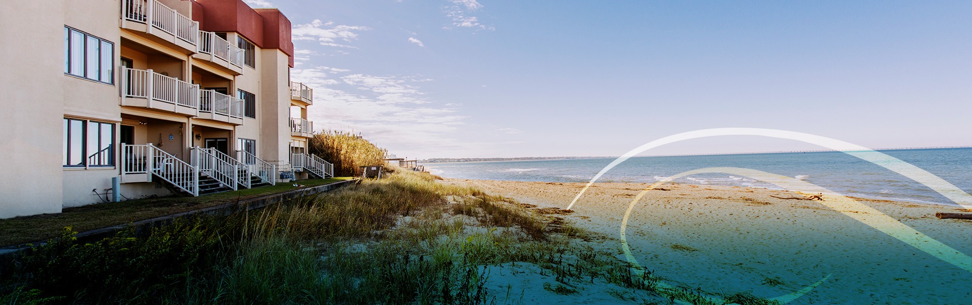 Wide Shot of Ocean with Homes to the Left