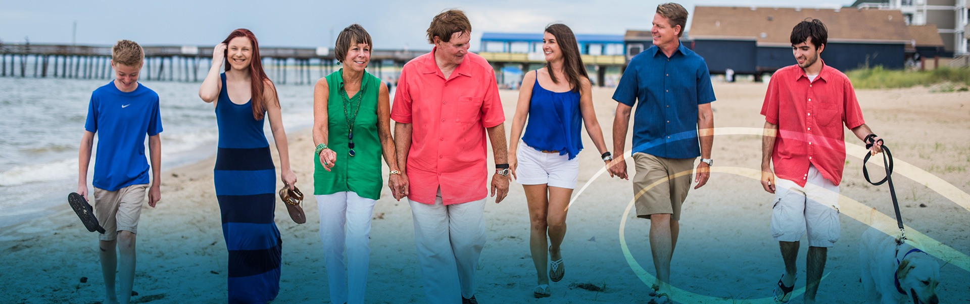 Family Walking Together on the Beach Shoreline