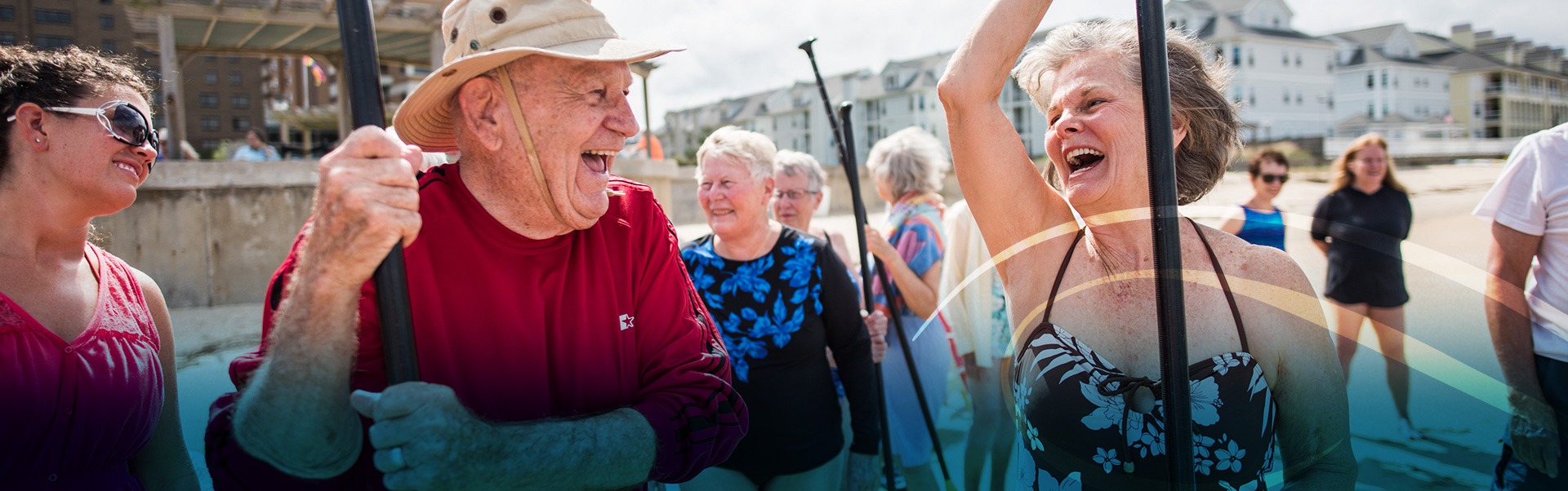 Retired Man and Woman Laughing on the Beach