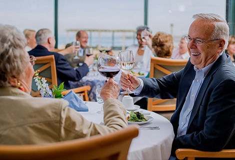 Man and Woman Drinking Wine at Dinner Event