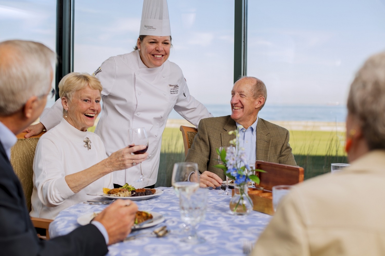 Chef Smiling with Community Residents