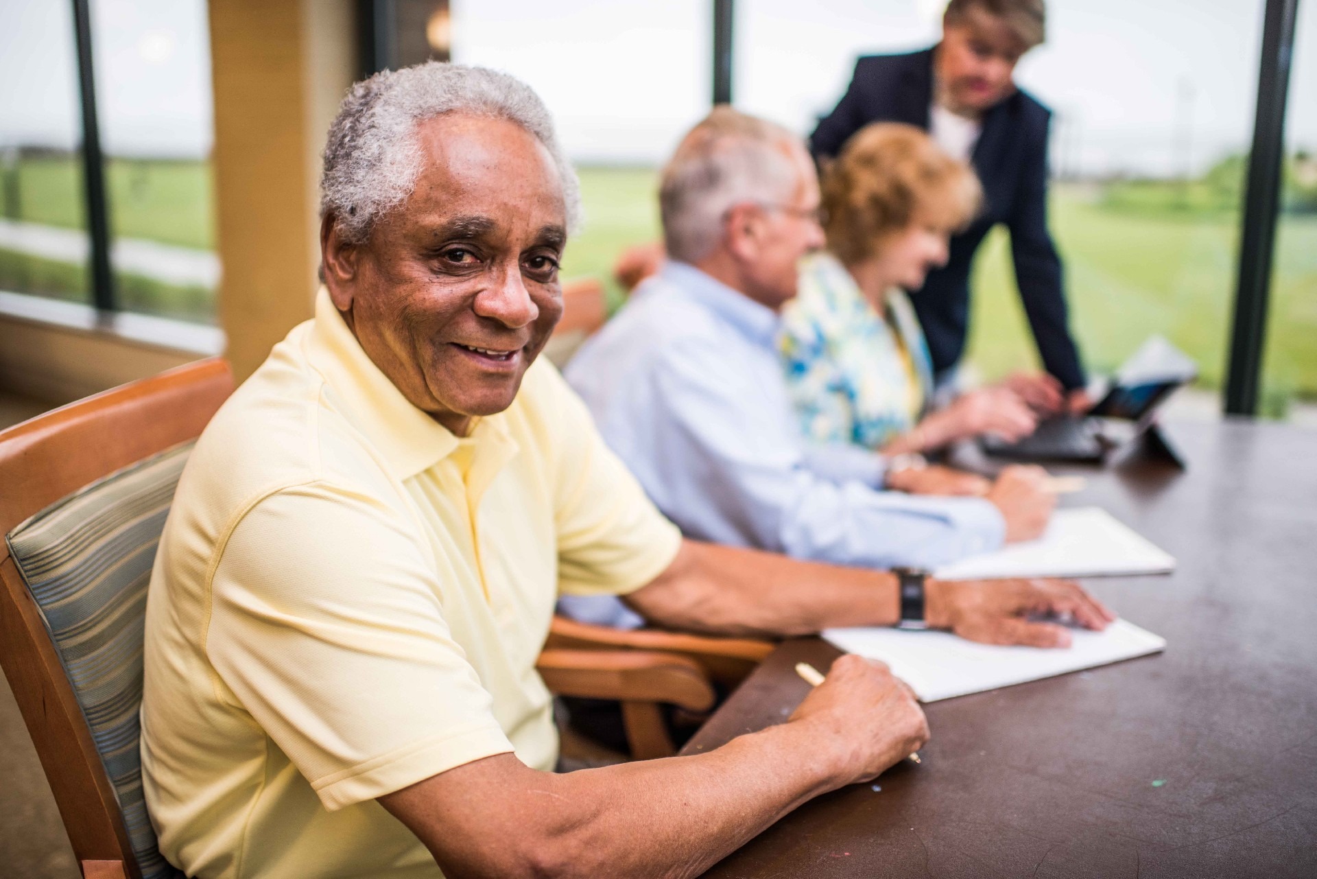 Man Smiling at Table