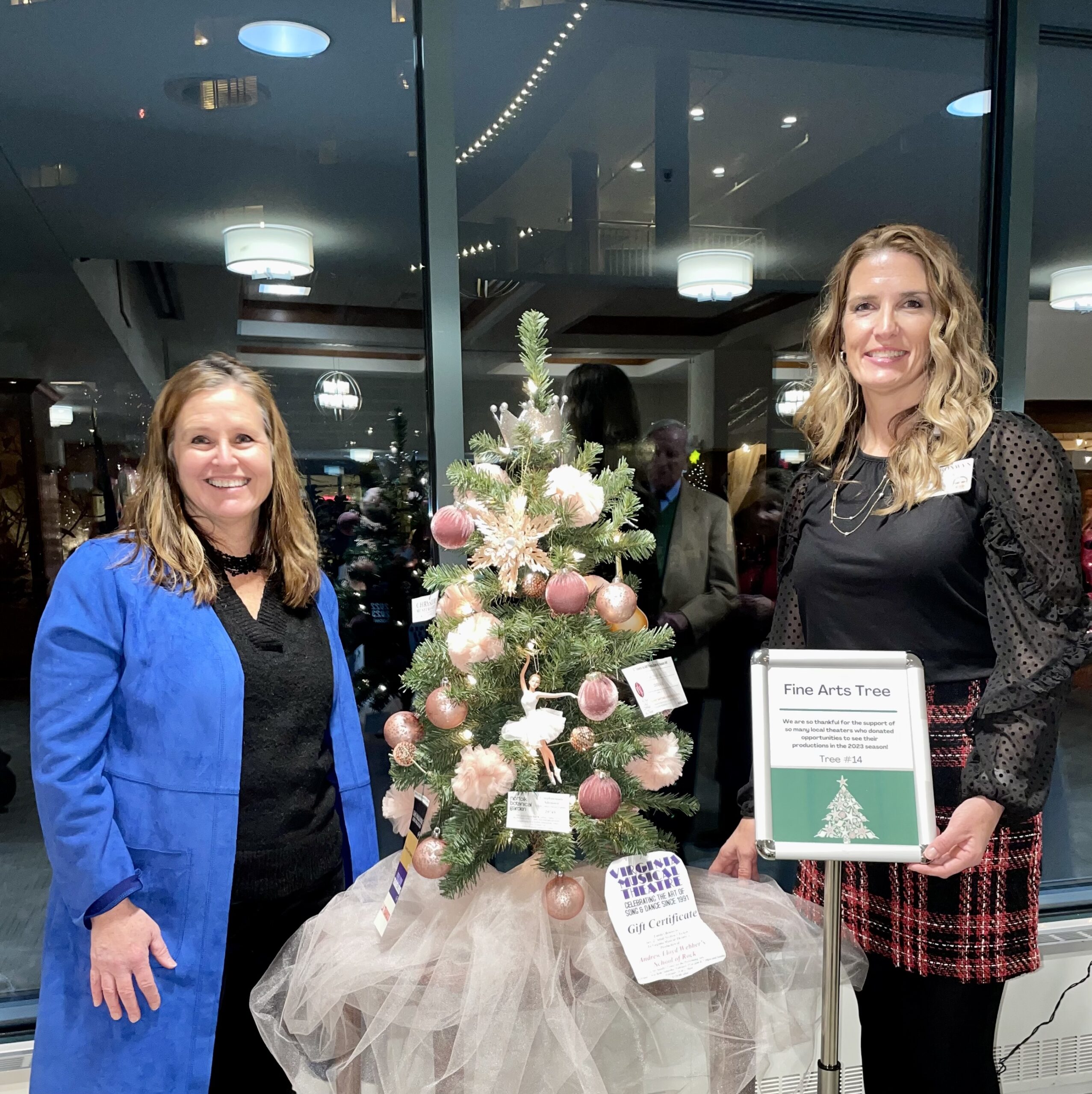 2 Woman Smiling Next to Fine Arts Tree