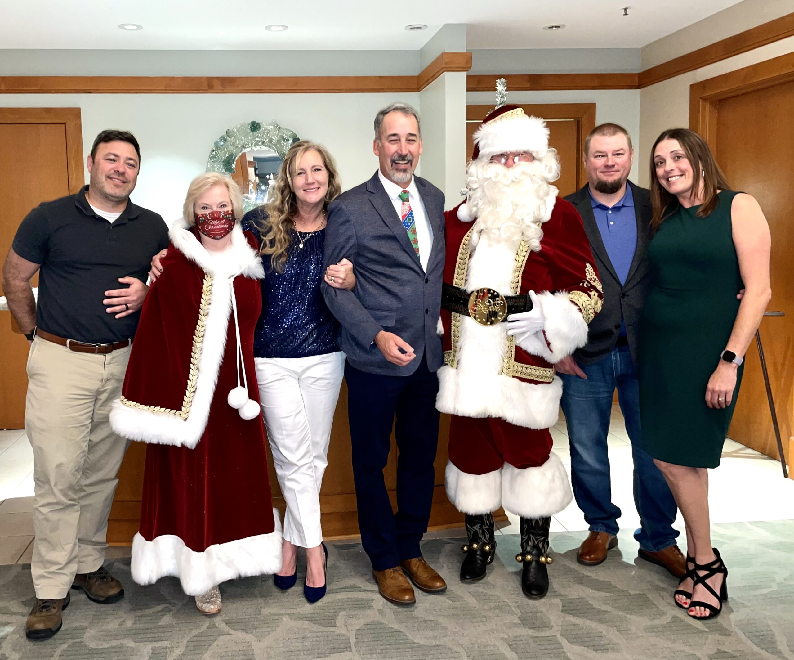 Santa Clause Smiling with Party Guests