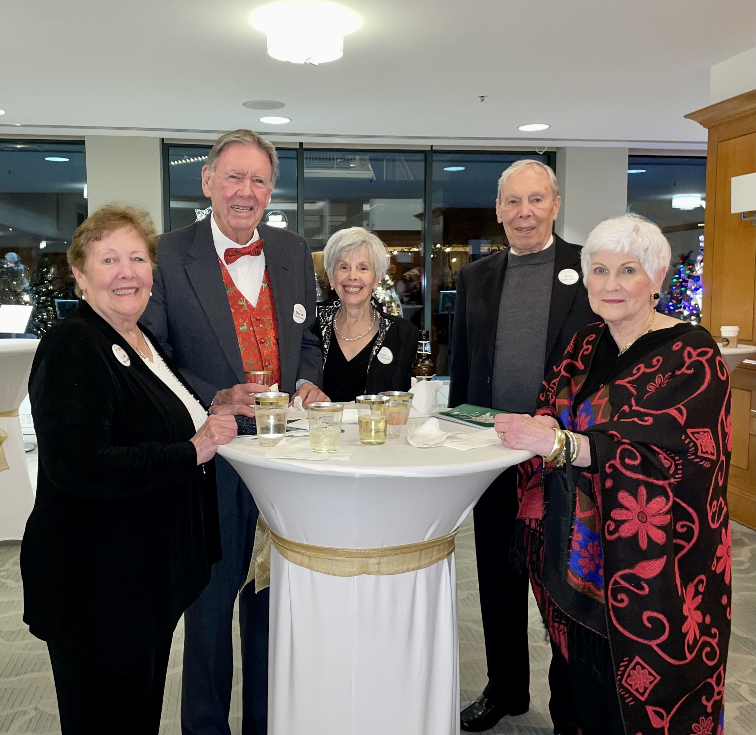 Group of People Smiling at Table Together