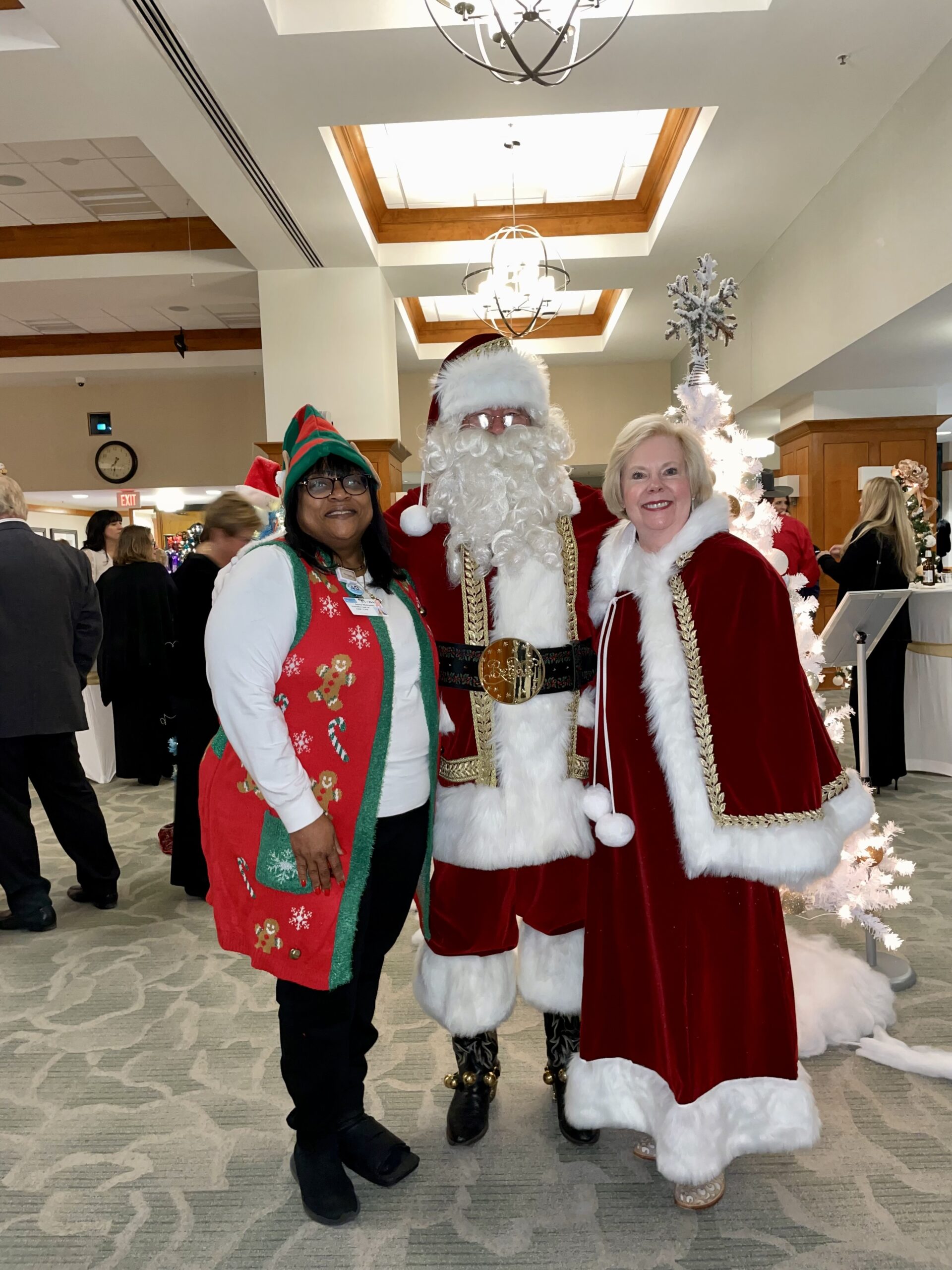 Santa with Woman Elf and Mrs. Claus