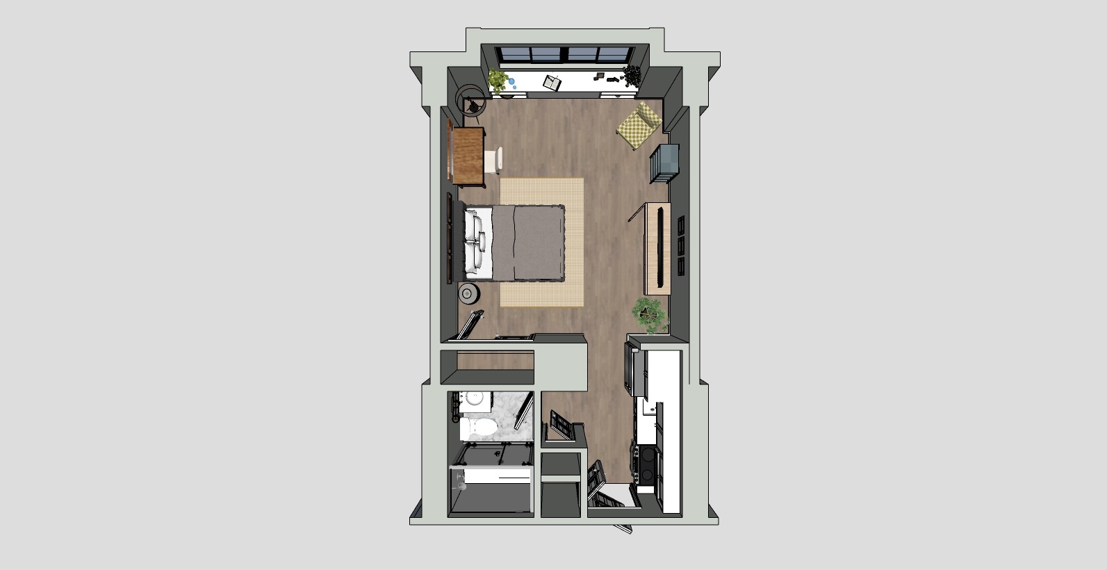 3D layout of a rectangular studio apartment with a bed, desk, and chair on a wooden floor. It includes a kitchenette, a small dining area, and a bathroom. Large windows are on one wall, and there are plants for decoration.