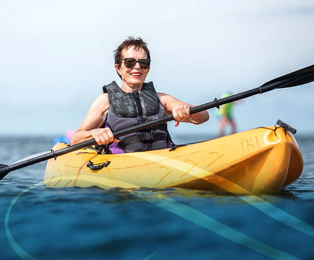 Women rowing a kayak