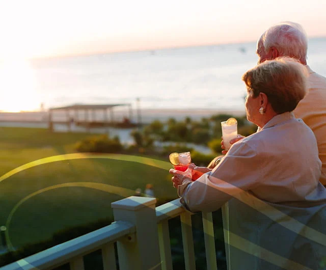 Couples watching the sunny beach view at WCC Senior Living Community